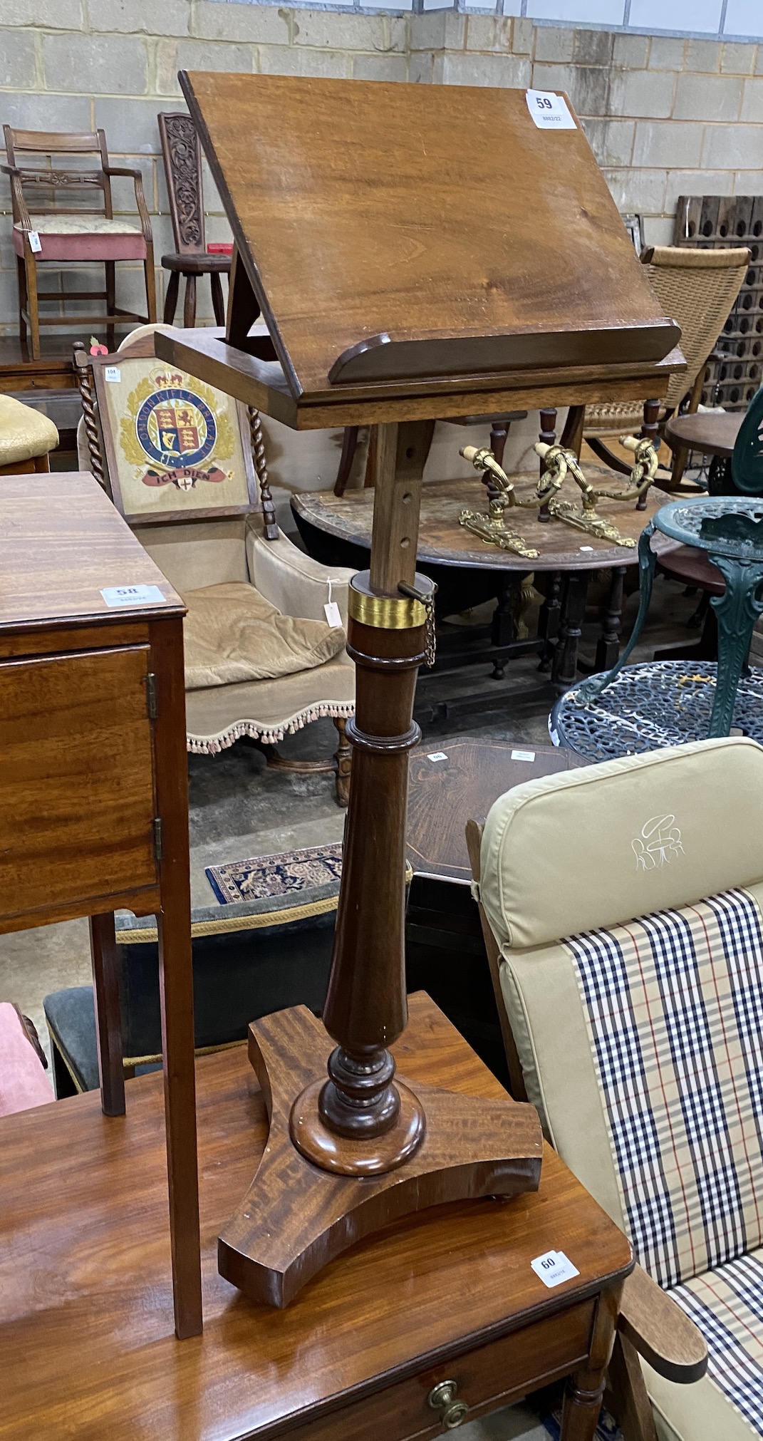 A Victorian style brass mounted mahogany adjustable reading table